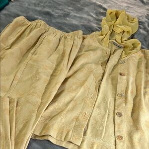 Ivy large pant suit.  Gold in color.  Pants have pockets.